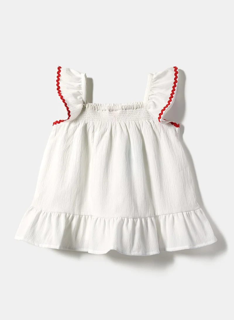Nautinati  Girls' A-line Polka Dot Embroidered Dress with Multicolour Tassels & Smocked Neck for Women | Best Price UAE